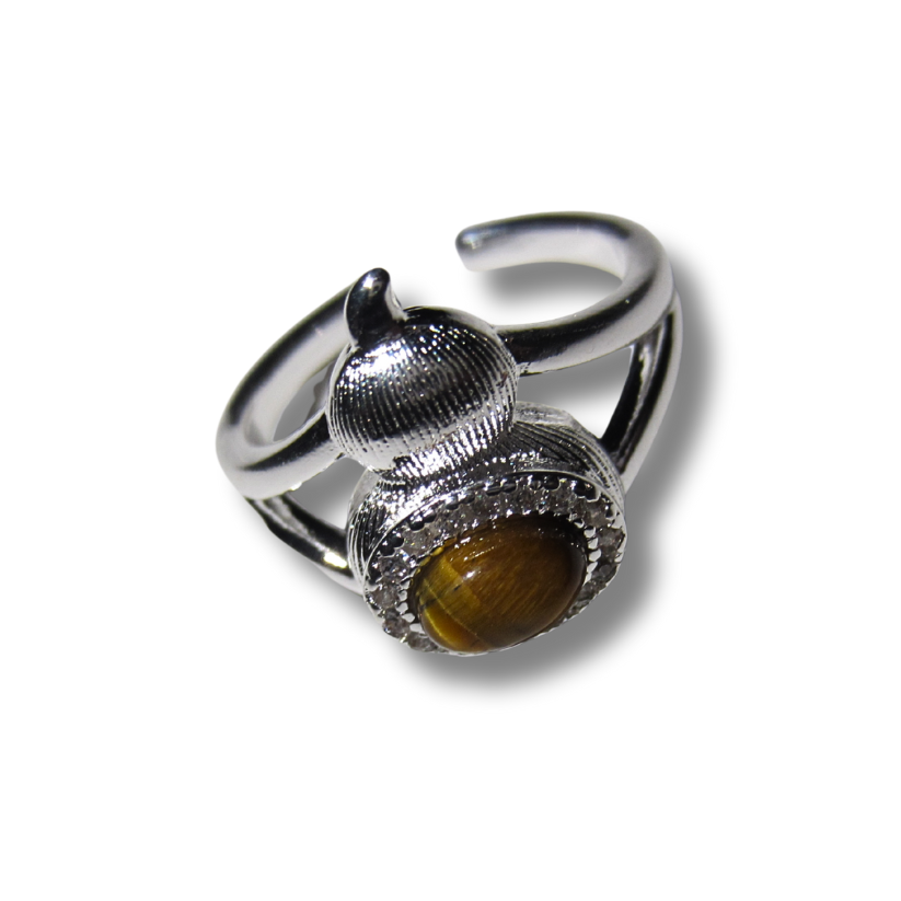 Silver ring with a yellow gemstone on a white background