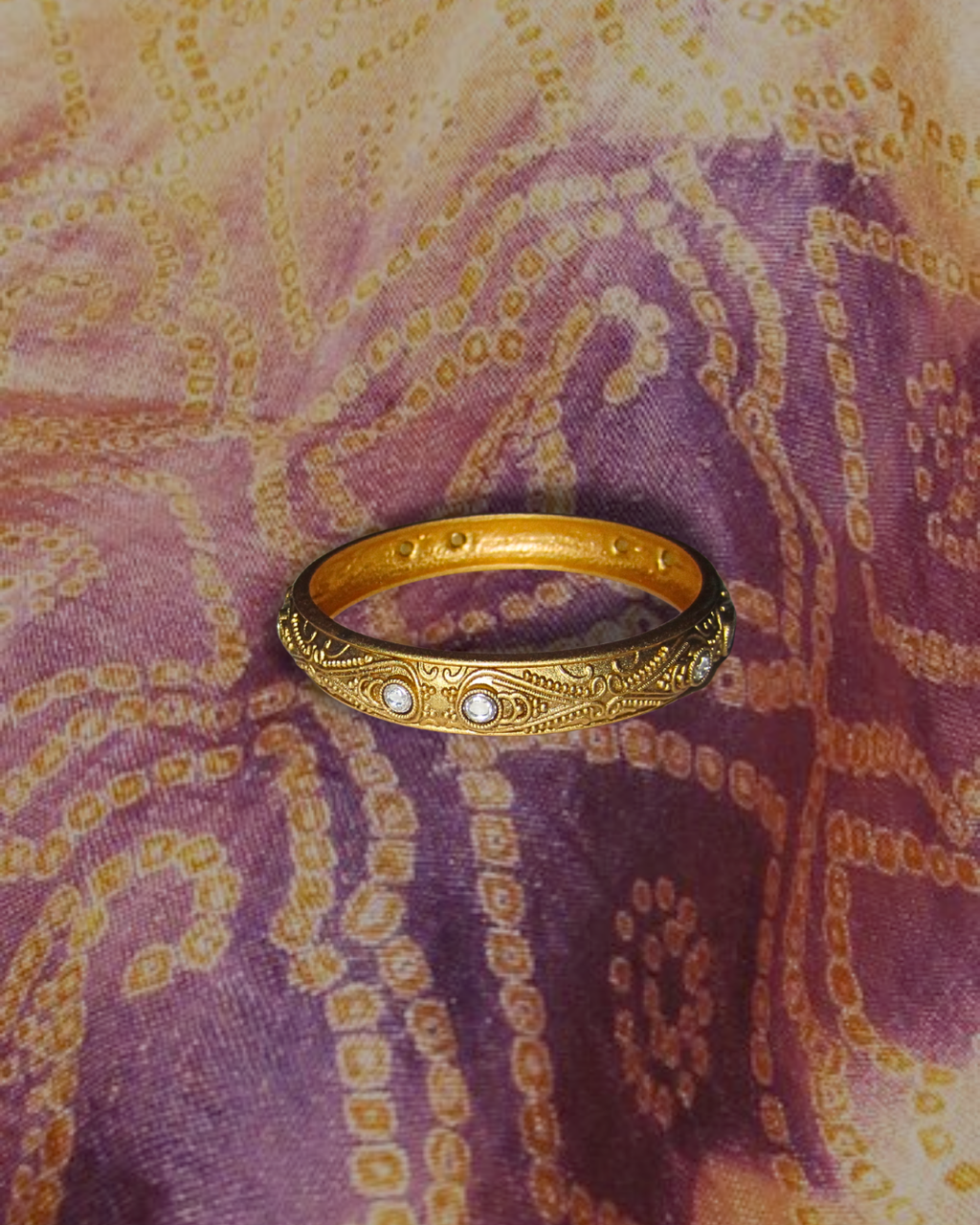 gold bangle with silver gems