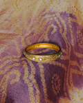gold bangle with silver gems