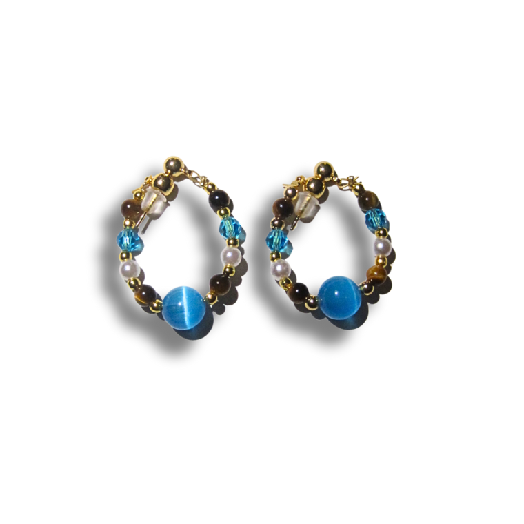 Pair of beaded earrings with blue beads on a white background