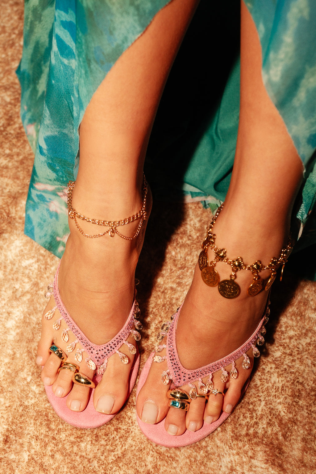 girl wearing pink heels and gold toe ring stack